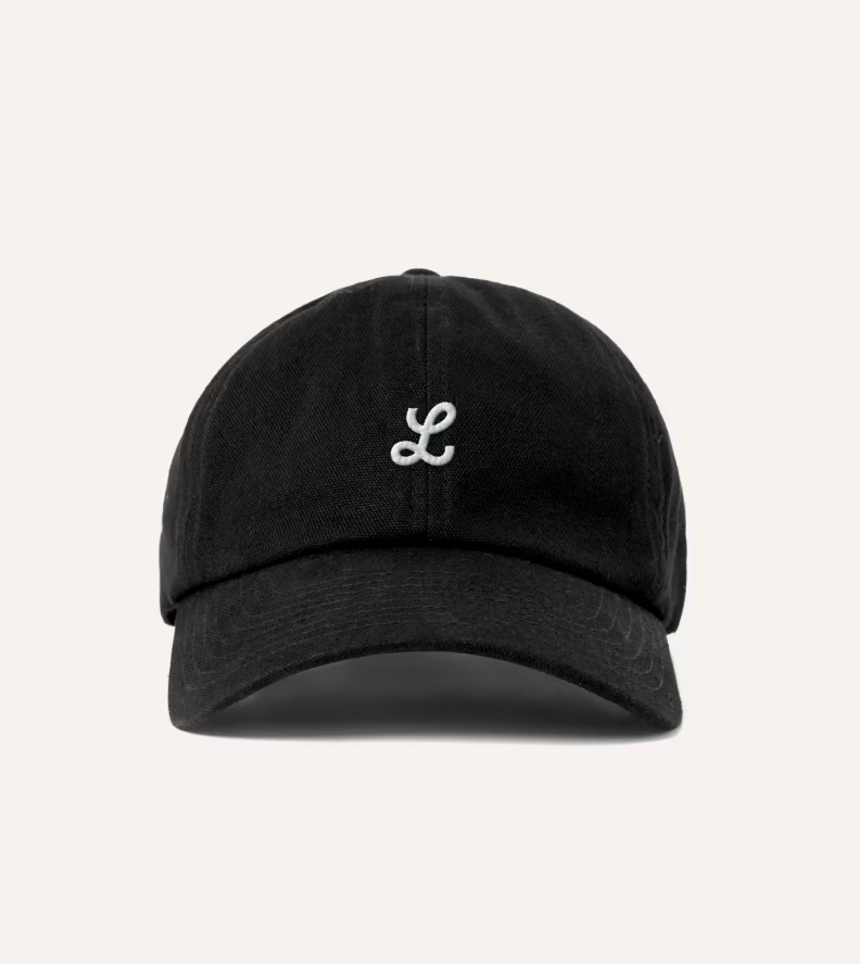 A black cap embroidered with the L monogram